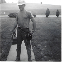 Robert Burgdorf as an electrician's assistant leaving his house for first day of work